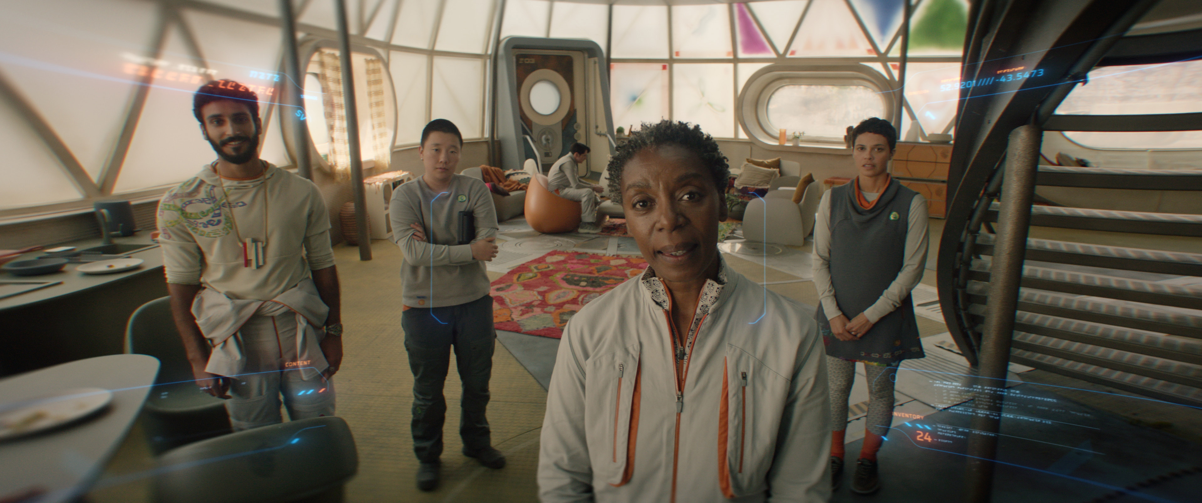 Group of humans looking directly at Murderbot, as seen from its perspective